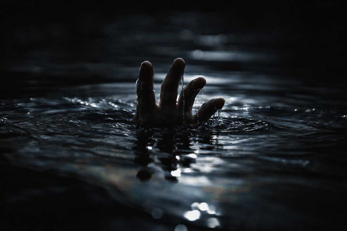 Close detail of the drowning hand
