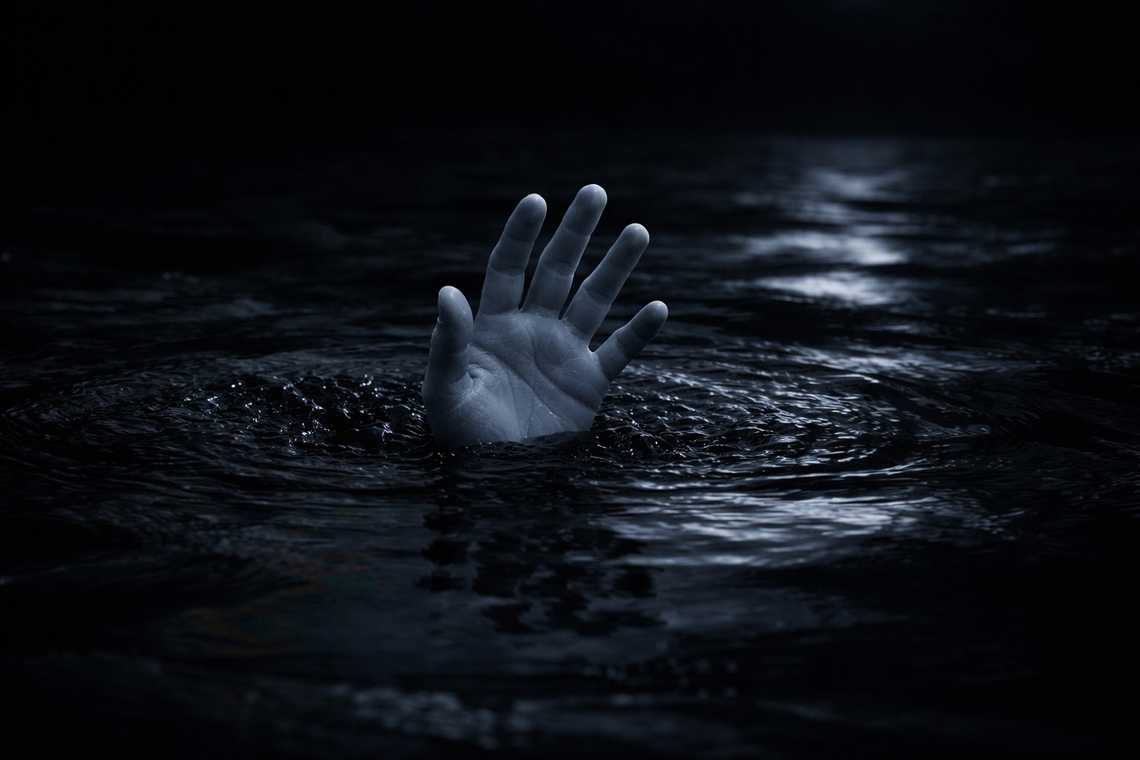 Vision of black water and a sinking hand