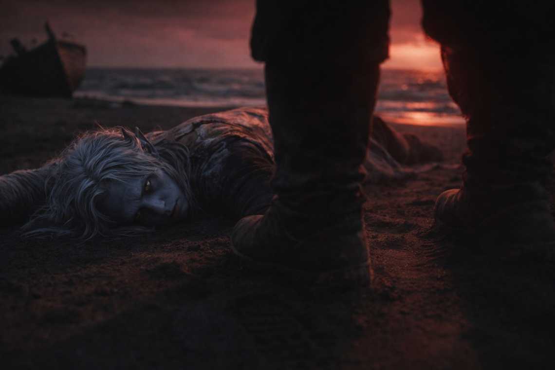 A looming shadow falling over Drusniel on the beach