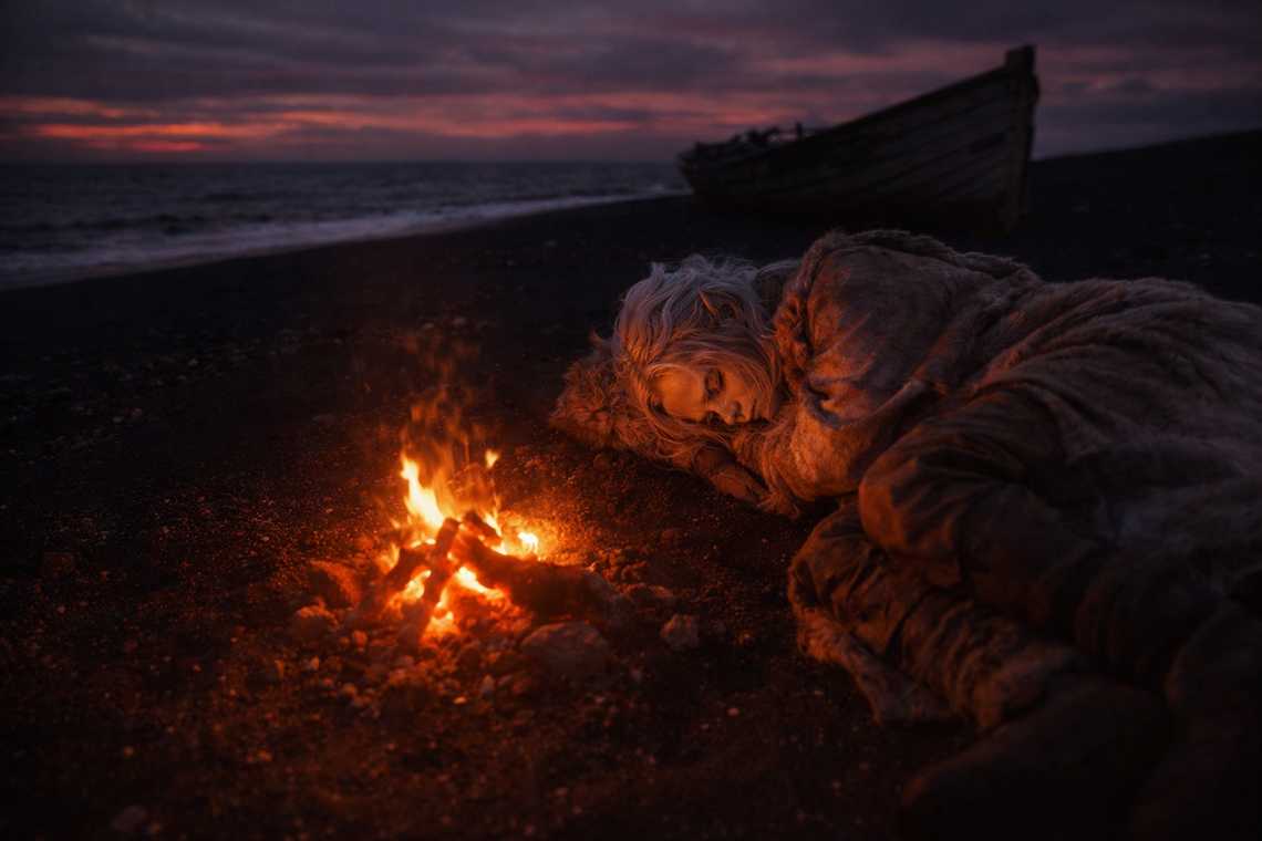 Drusniel sleeping by a coastal fire